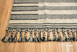 Beige flatweave rug placed in an entryway