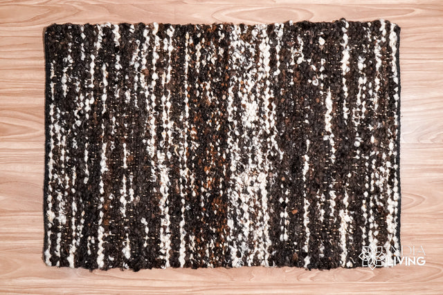 Handcarded wool rug styled in a living room