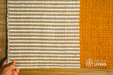 Striped wool rug styled in a hallway runner layout