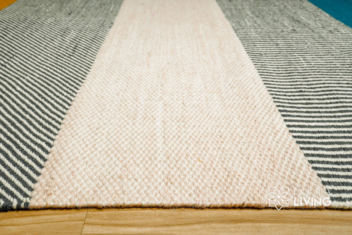 Detail of striped wool rug edge finishing