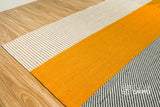Striped wool rug placed in an entryway