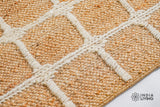 Natural jute rug in a coastal styled entryway