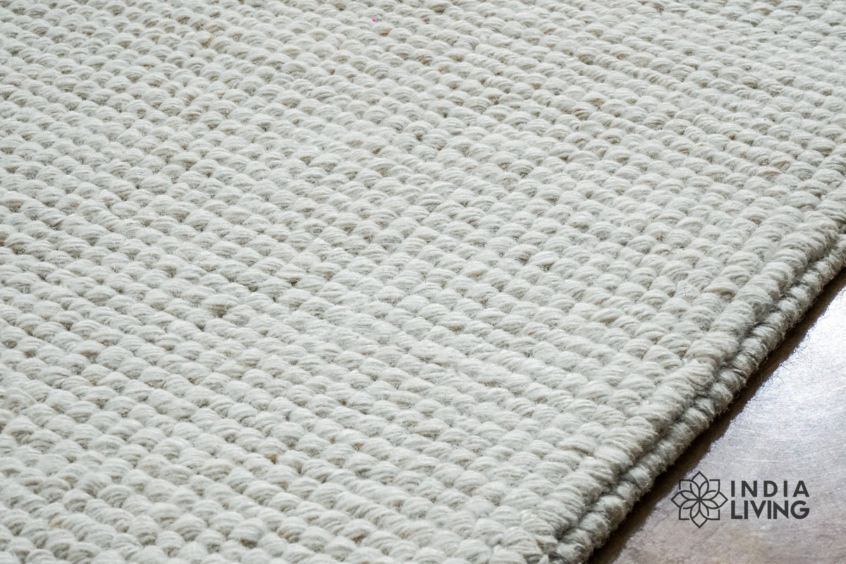 Ivory loop weave rug in natural daylight