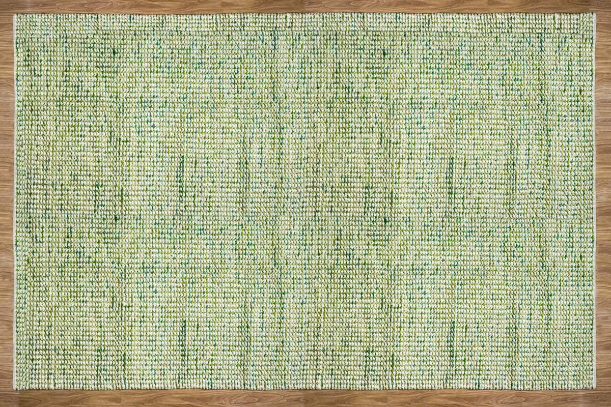 Cashew Loop — full rectangular green and ivory chunky wool loop rug viewed overhead on wood flooring