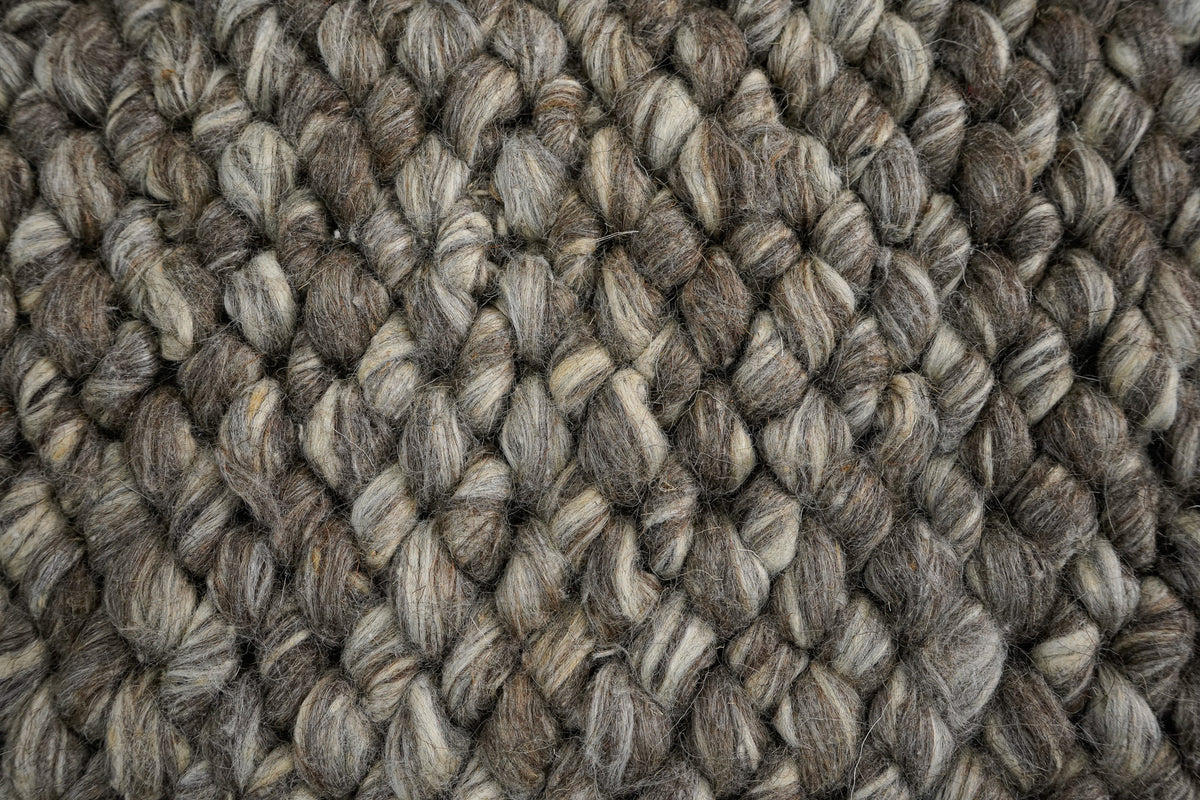 Brown Cashew Loops — wool rug in tight detail showing lighter strands winding through darker loops