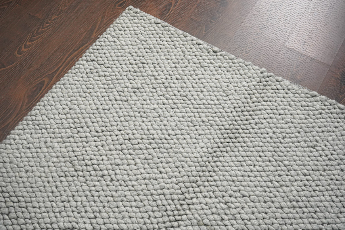 Gray Cashew Loops — wool rug angled corner view showing the repeating texture across the surface