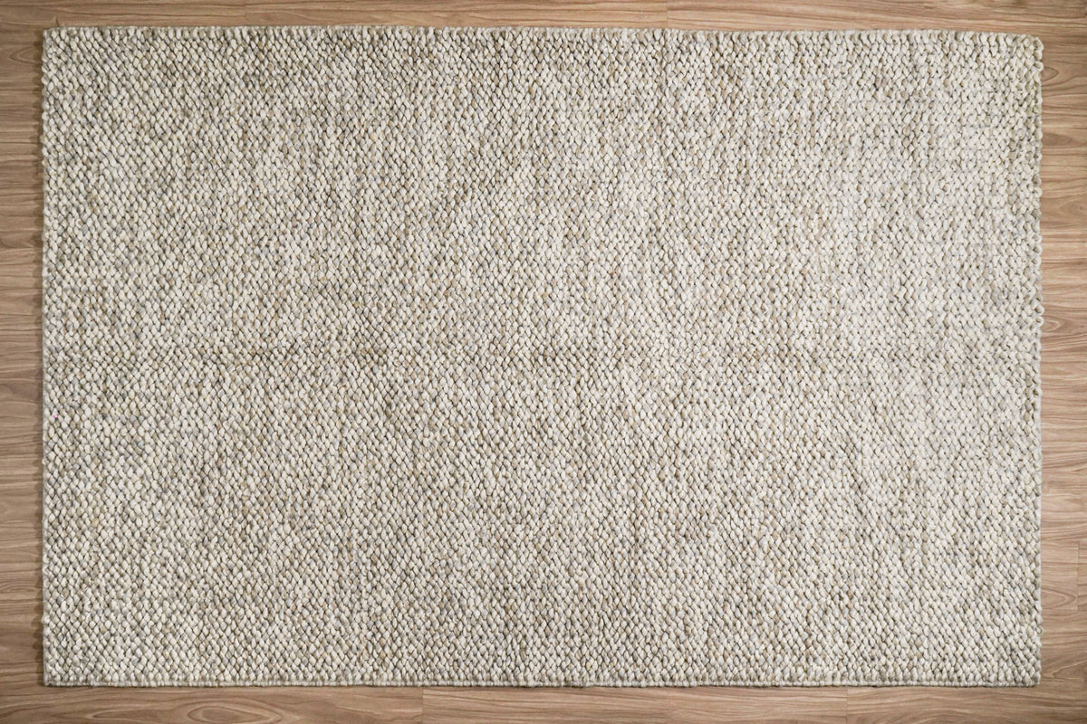 Gray Cashew Loops — wool rug shown fully from above on wood flooring
