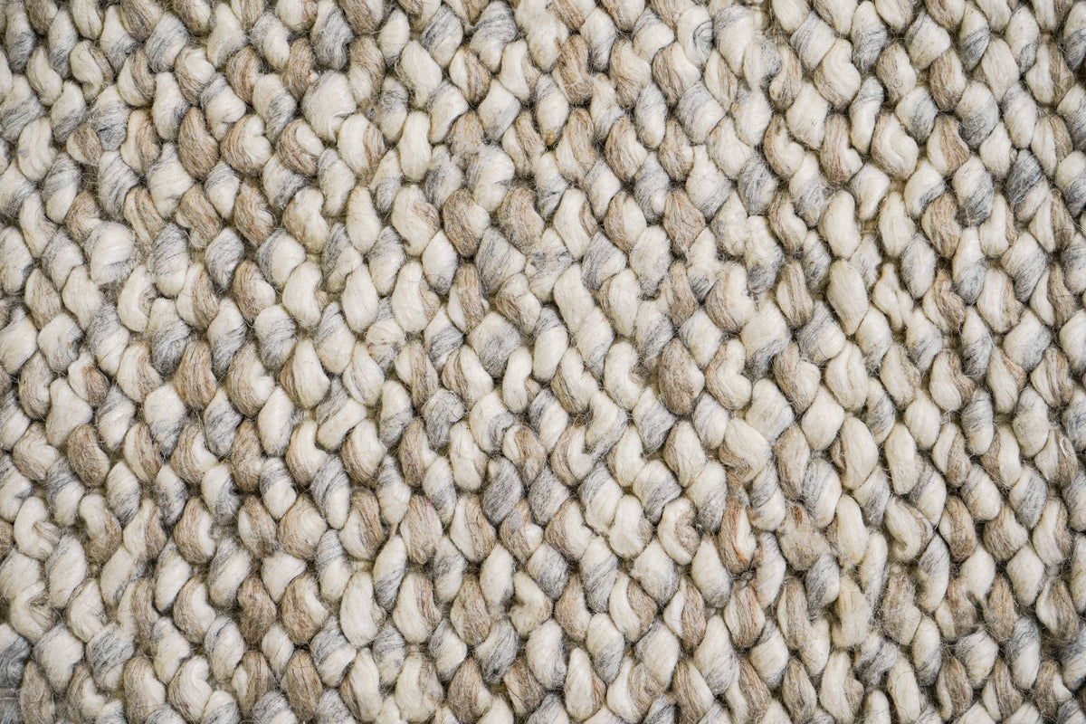 Cashew Loops — wool rug in a top-down detail of closely repeated ivory, beige and gray loops