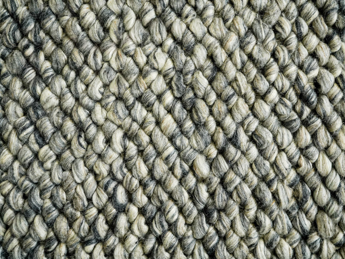 Cashew Loops — Wool rug with diagonal rows of light and dark gray loops