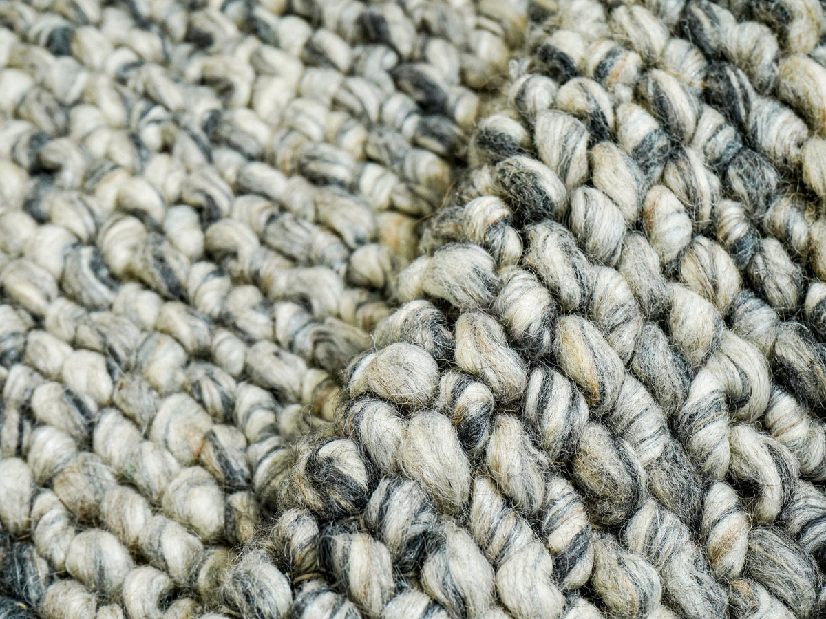 Gray Cashew Loops — Wool rug with raised folds highlighting the rounded loops and visible fibers