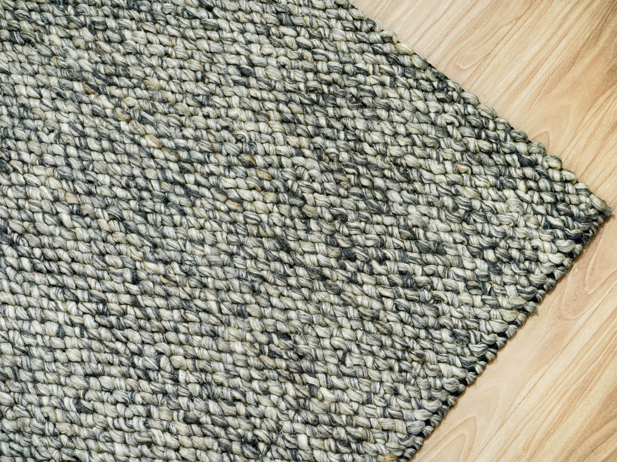 Gray Cashew Loops — Wool rug showing a projecting right corner and dense loops along the edge