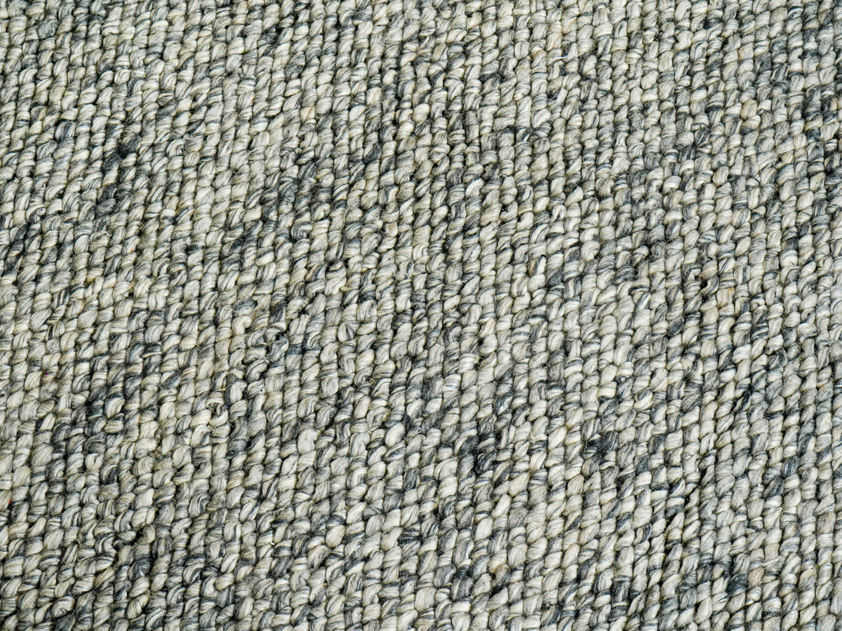 Gray Cashew Loops — Wool rug in an overhead texture detail with narrow dark streaks between loop rows