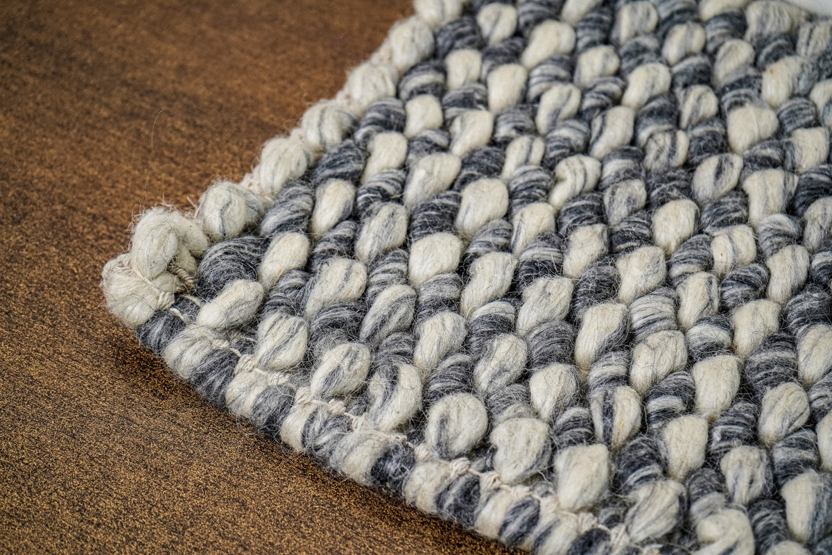 Gray Cashew Loops — close-up of the weave, chunky loop pile, and wrapped edge finish