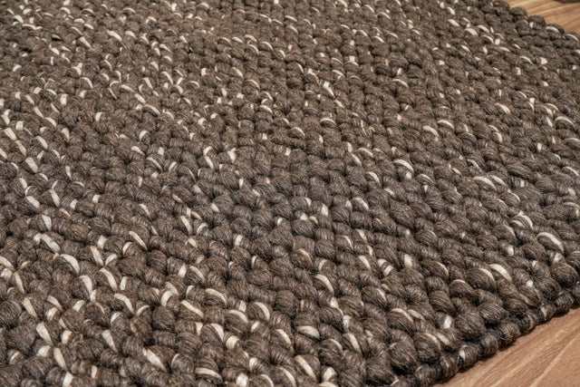 Cashew Loop — close-up of the weave, chunky loop pile and edge finish in brown and ivory