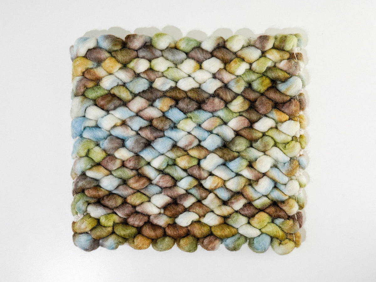 Multicolor Cashew Loop — Wool rug viewed from above, showing the full square sample on white