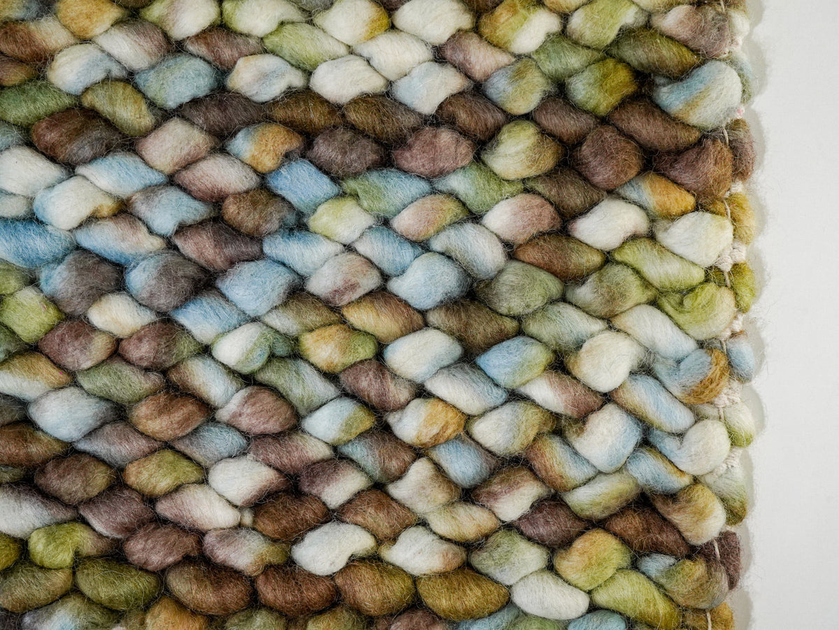 Multicolor Cashew Loop — Wool rug close-up of the front surface beside the right edge