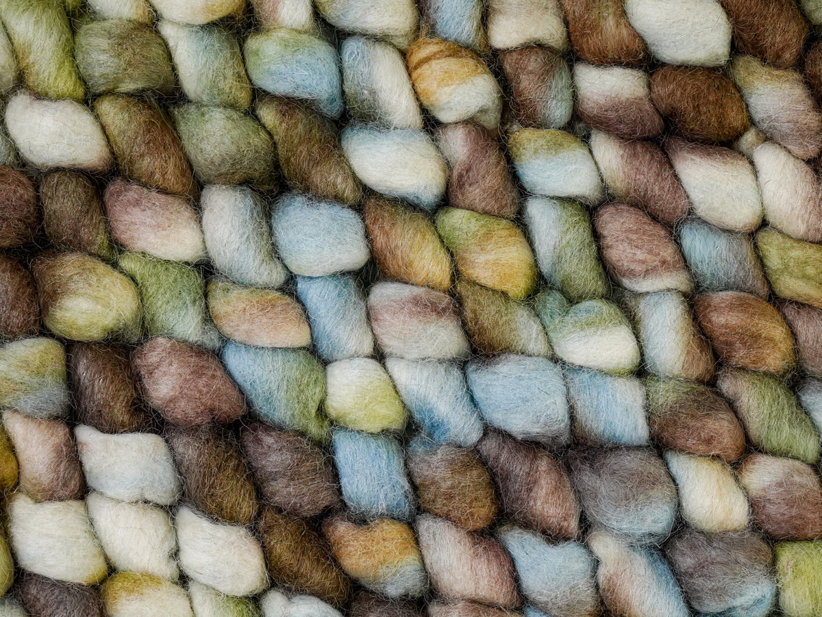 Cashew Loop — Wool rug tightly cropped to show the dense arrangement of multicolor loops