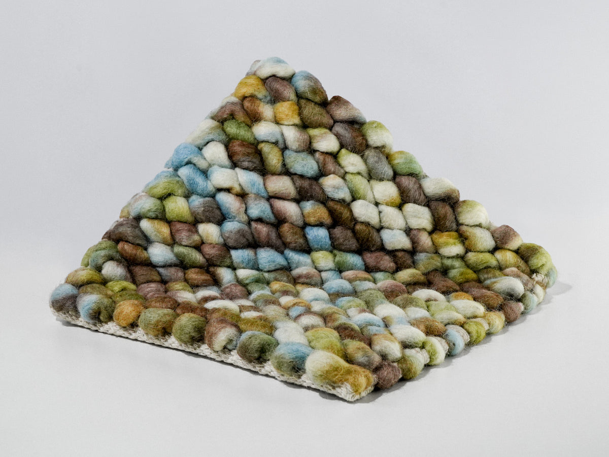 Cashew Loop — Wool rug styled in a living room, highlighting its multicolor loop texture