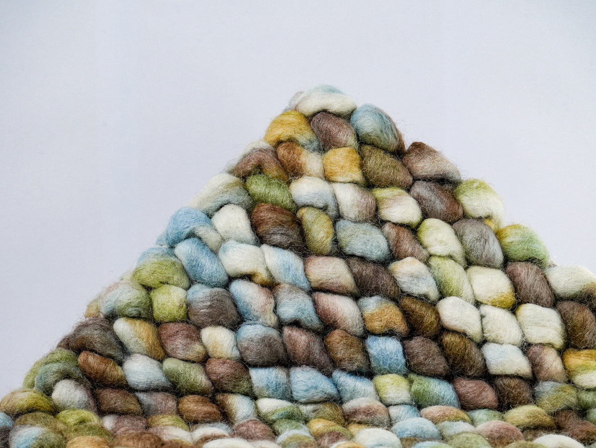Multicolor Cashew Loop — Wool rug folded into a peak to display the front loop texture