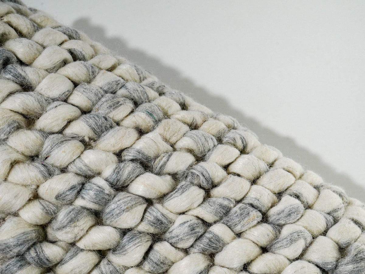 Gray Cashew Loop — Wool rug showing a diagonal edge and individual rounded loops
