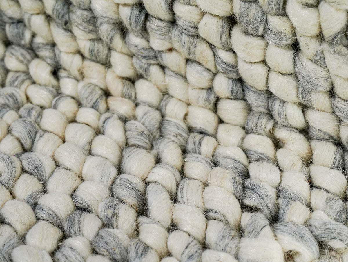 Gray Cashew Loop — Wool rug with a close-up of the chunky loops across a fold