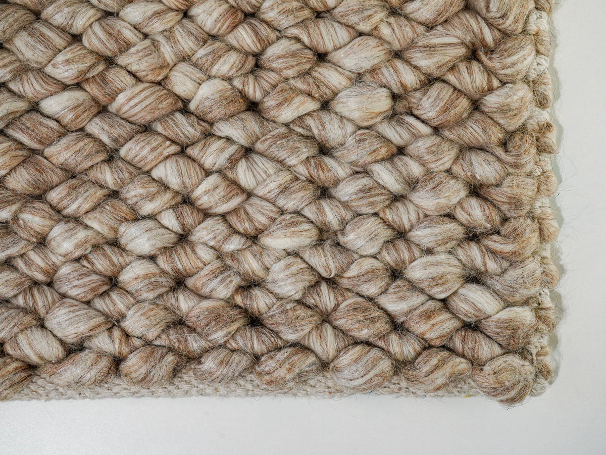 Beige Cashew Loop — Wool rug, lower-right corner with closely packed loops and a finished border