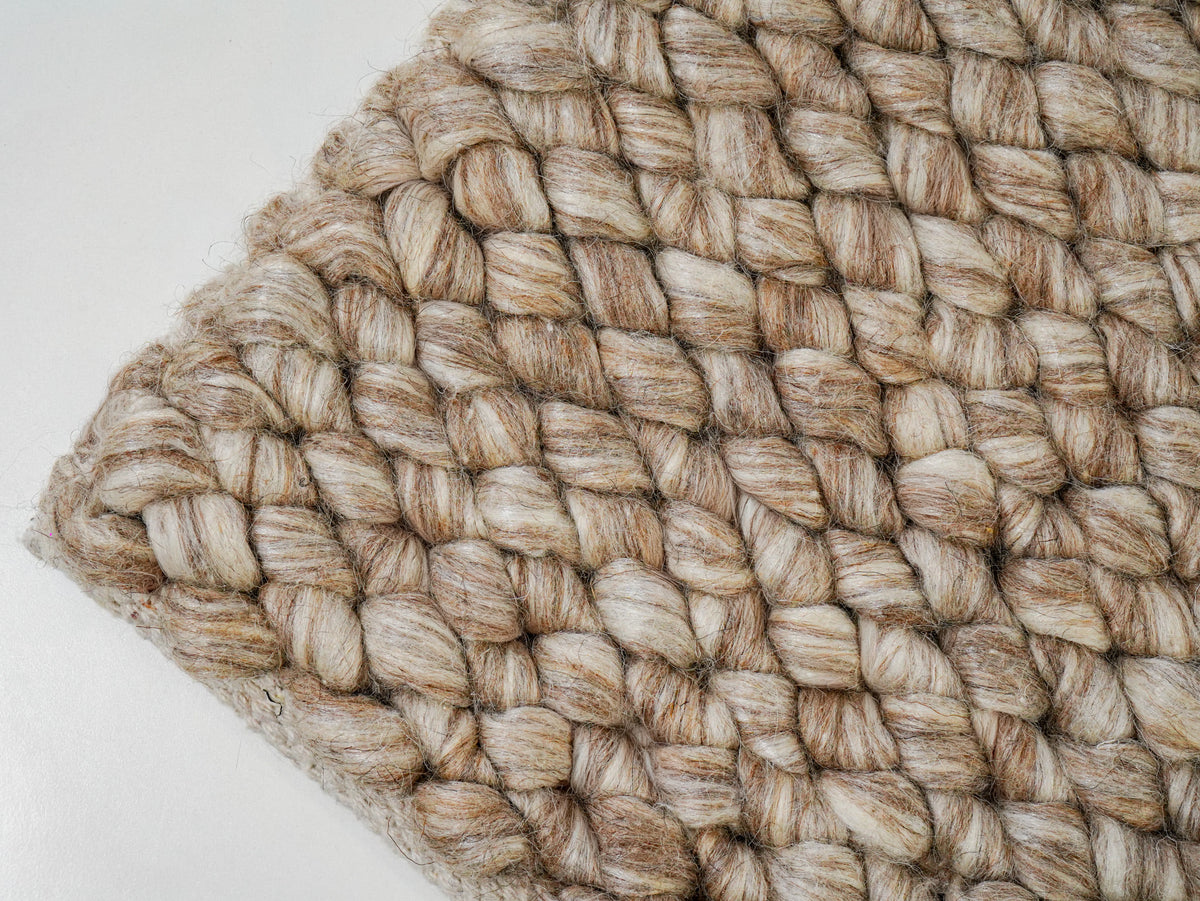 Beige Cashew Loop — Wool rug, angled corner view revealing the diagonal arrangement of chunky loops