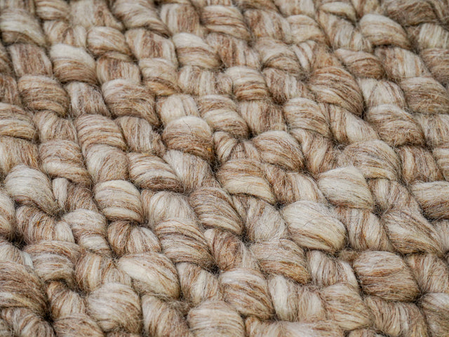 Cashew Loops — close-up of the weave, pile and edge finish, showing rounded beige and tan loops