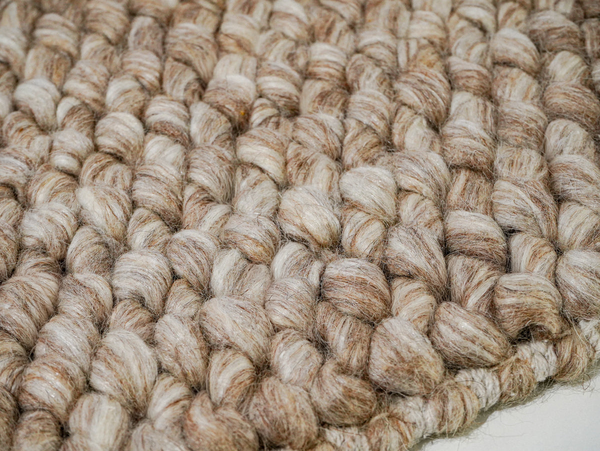 Beige Cashew Loop — Wool rug, surface detail with rounded loops extending toward the near edge