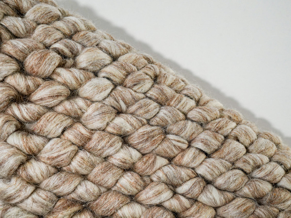 Beige Cashew Loop — Wool rug, diagonal edge detail with pale and tan strands visible in each loop