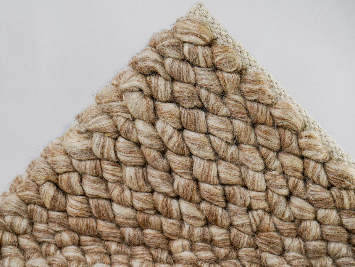Beige Cashew Loop — Wool rug, lifted front corner displaying dense rows of rounded loops