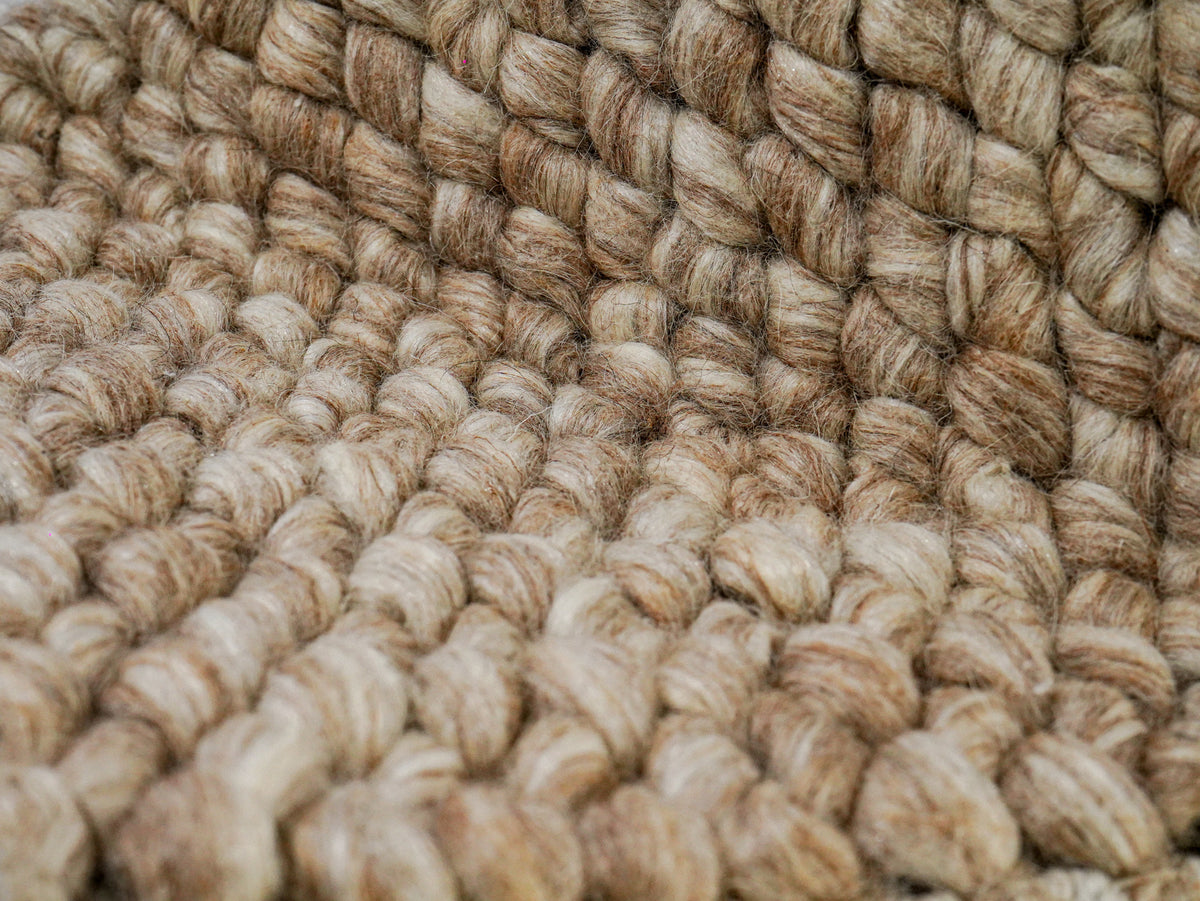 Beige Cashew Loop — Wool rug, close-up of the folded surface with foreground texture