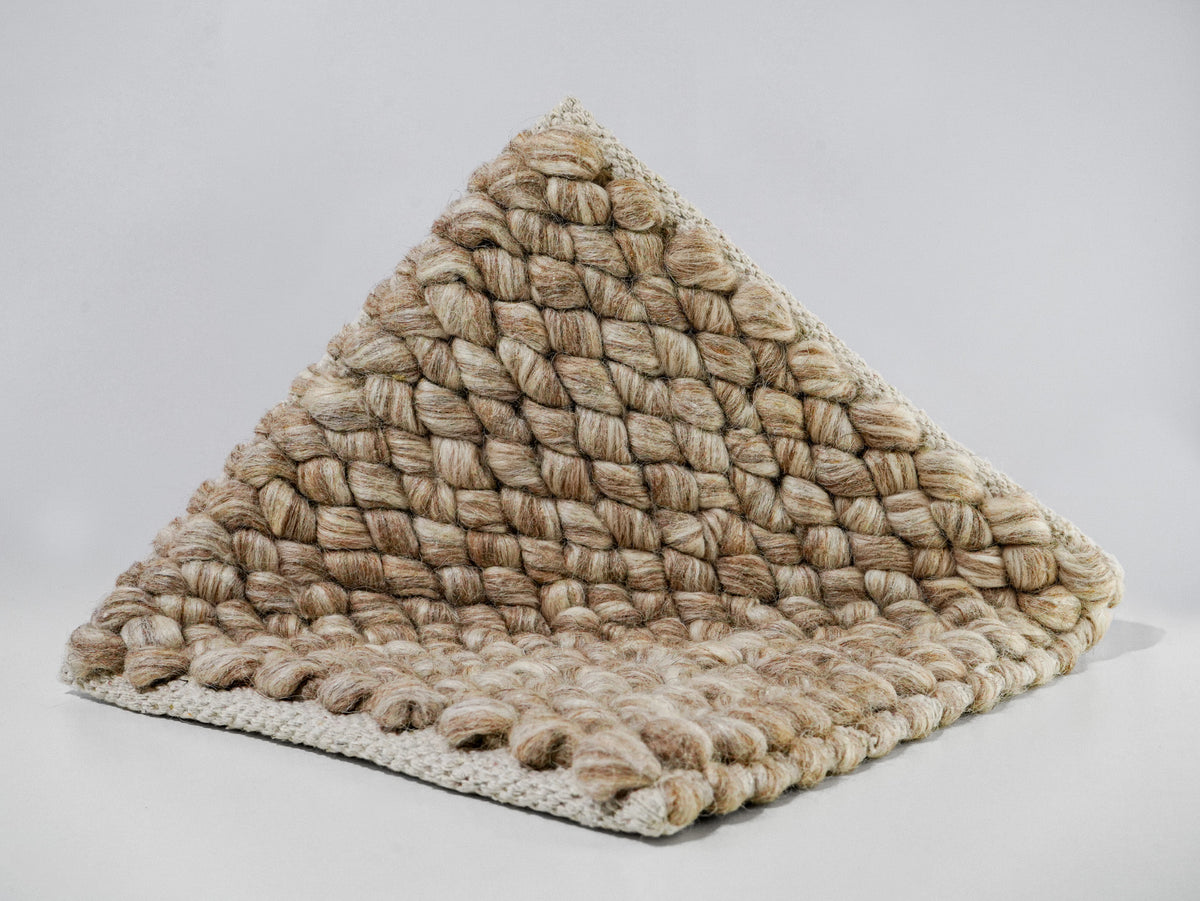 Beige Cashew Loop — Wool rug, folded sample on white showing the front surface and exposed underside edge