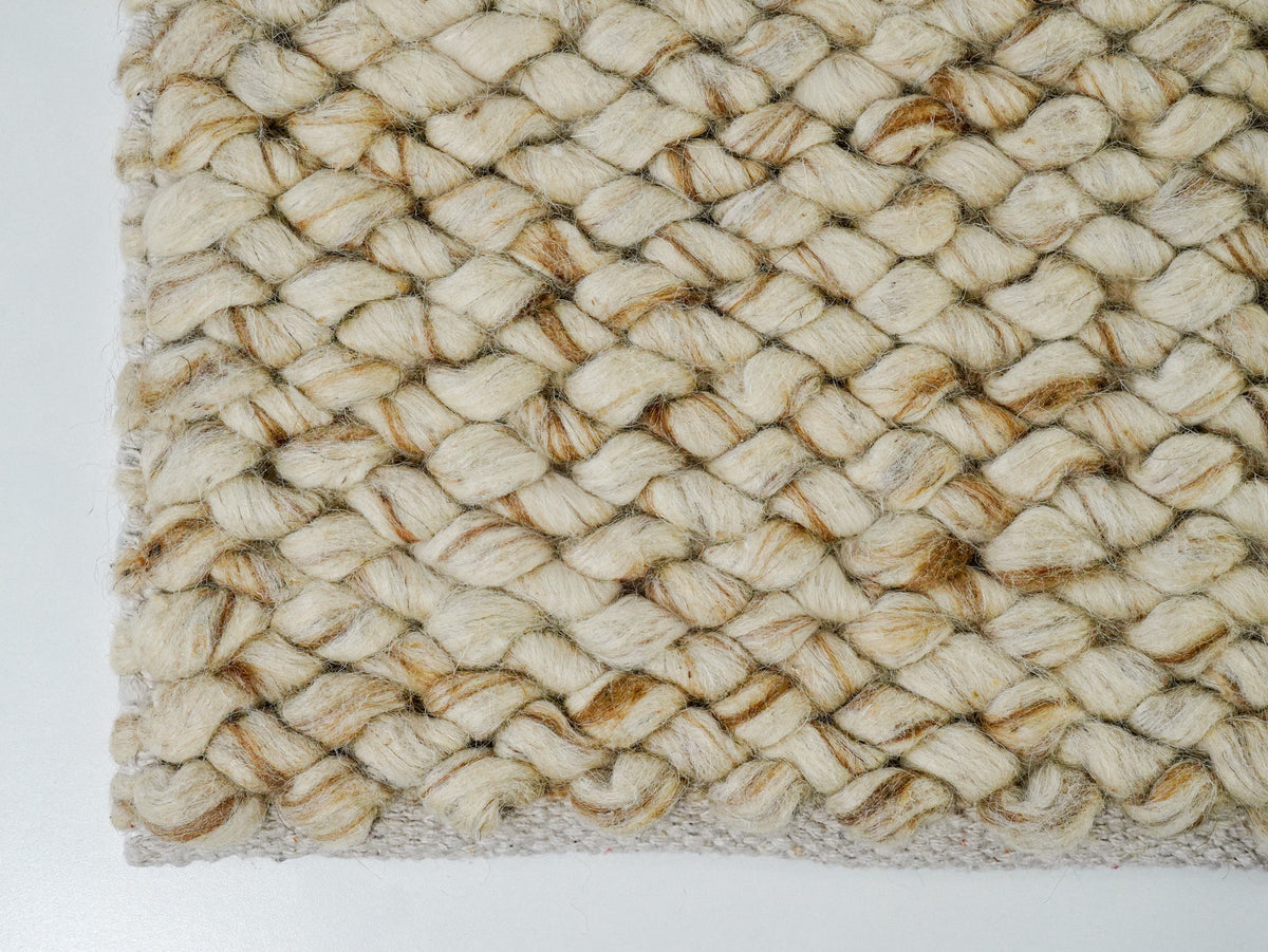 Beige Cashew Loop — Wool rug, close view of the lower edge and diagonal rows of chunky loops