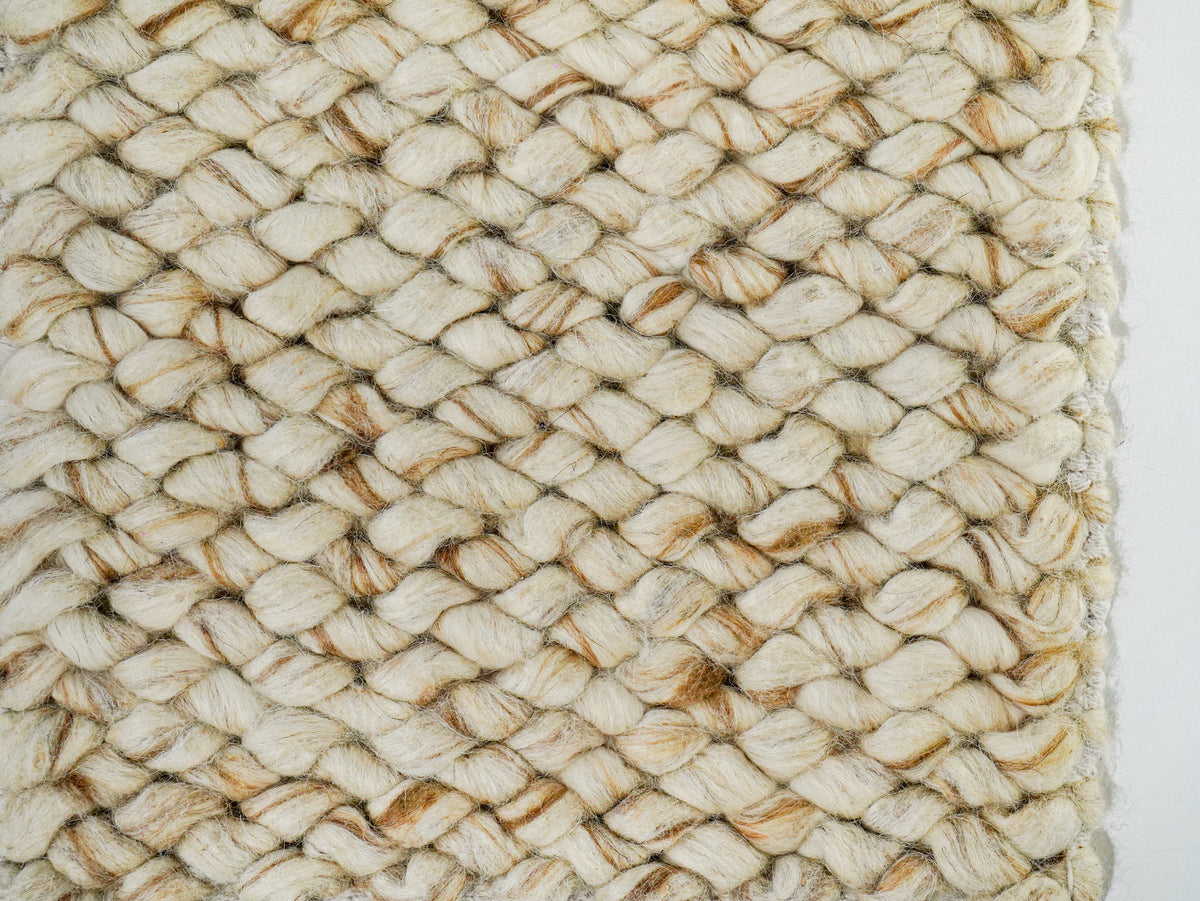 Beige Cashew Loop — Wool rug, overhead detail of tan accents beside the right edge