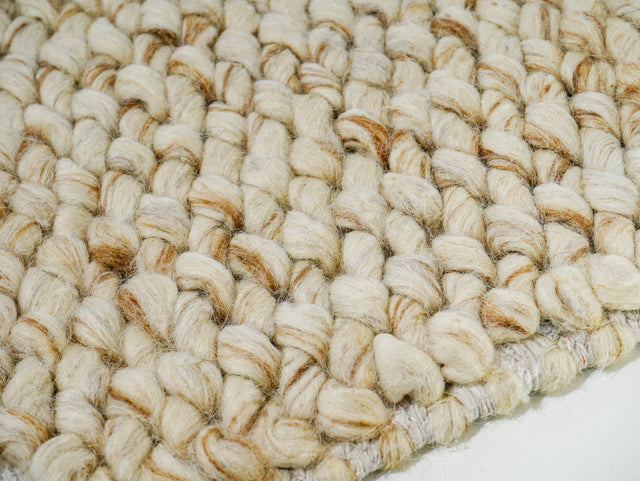 Cashew Loops — close-up of the weave, pile and edge finish, showing beige loops with tan accents