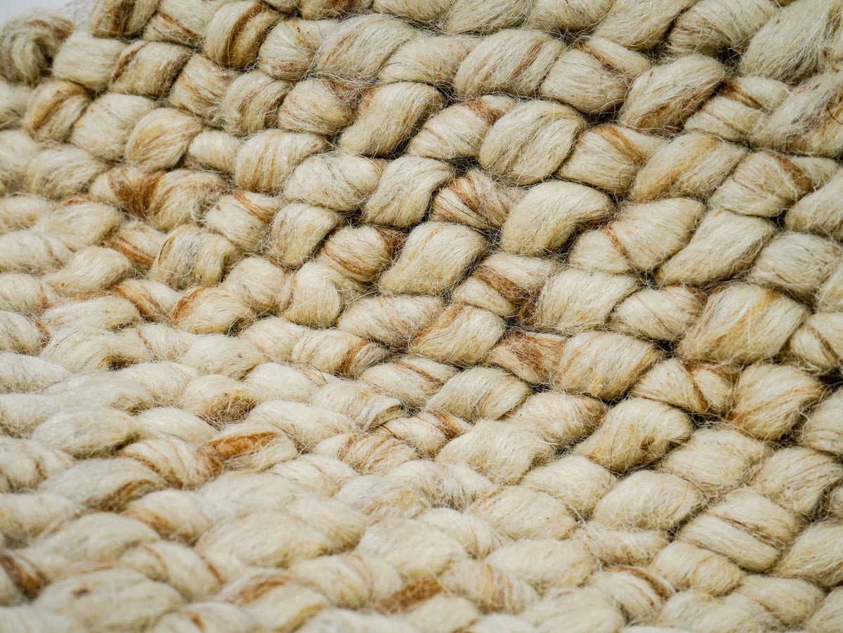 Beige Cashew Loop — Wool rug, draped surface close-up showing rounded loops across a fold