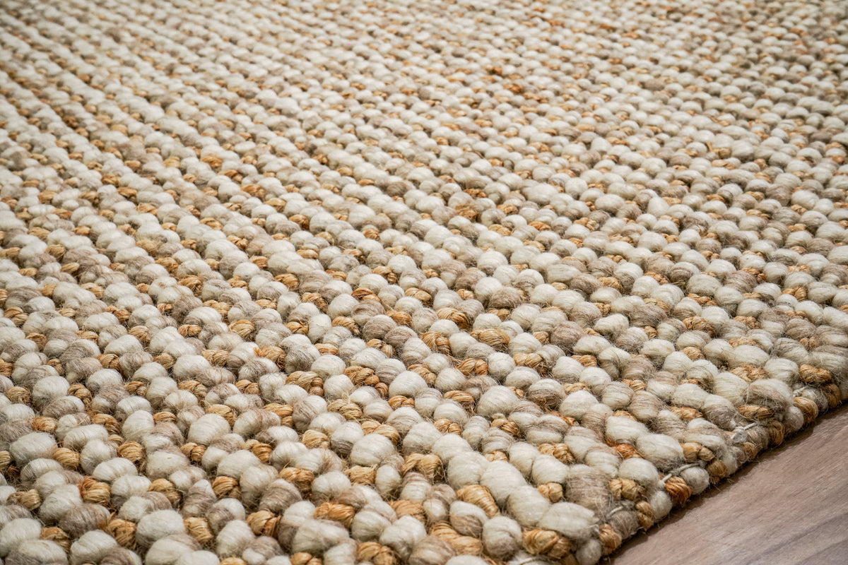 Loops With Jute — close-up of the weave, pile and edge finish on the beige rug, with rounded loops and tan strands