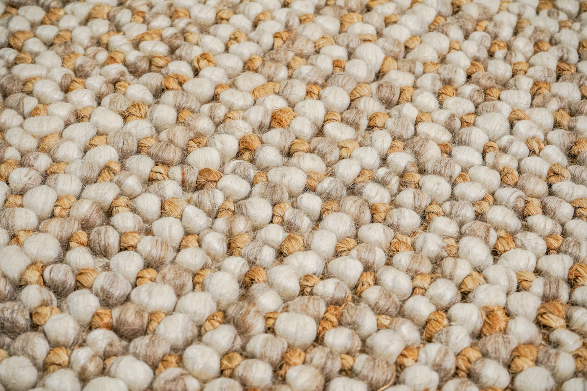 Loops With Jute — Beige Wool rug in a tight close-up of pale rounded loops interspersed with tan strands