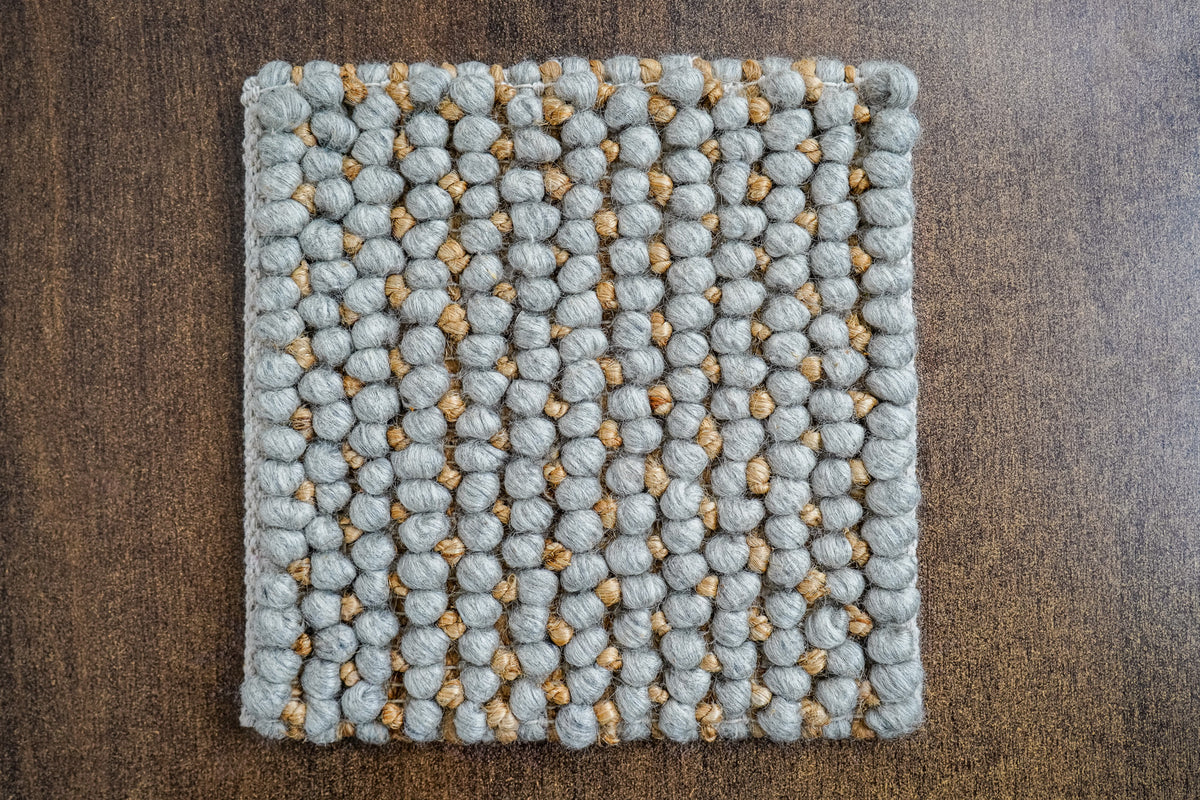 Loops With Jute — overhead view of a gray wool rug sample showing its full outline and loop rows