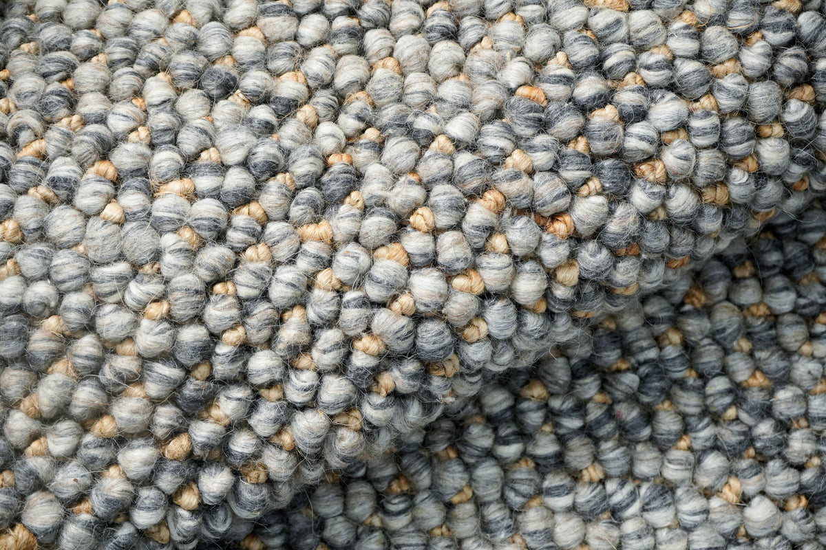 Loops With Jute — Gray Wool rug in a close view of rounded loops across a raised fold