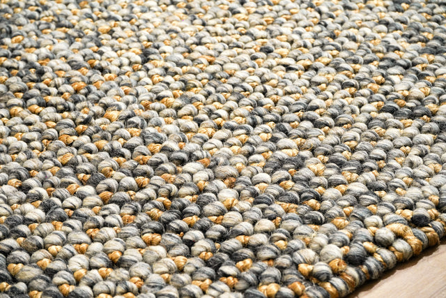 Loops With Jute — close-up of the weave, pile and edge finish, showing gray loops and golden-tan accents beside the floor