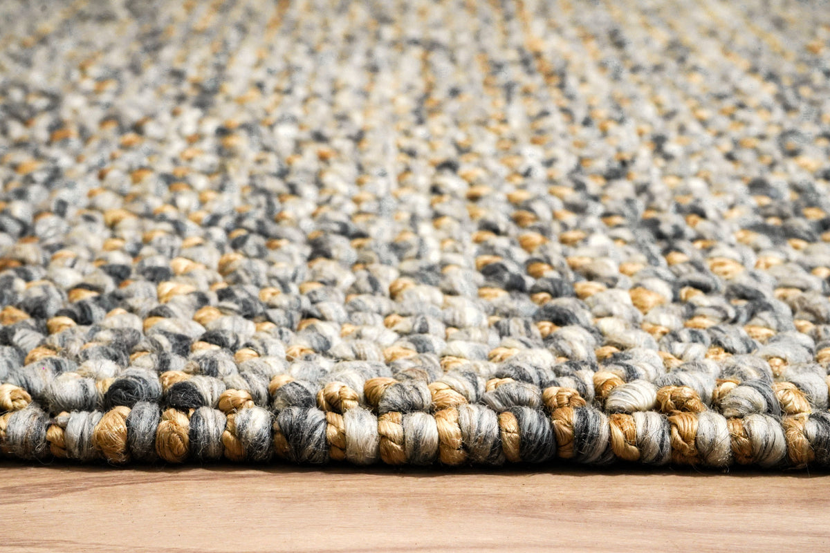 Loops With Jute — Gray Wool rug seen at floor level, showing the rounded loops along the edge