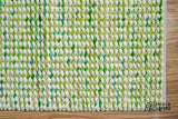 Cashew Loop — close-up of the weave, pile and edge finish, showing the edge binding and fringe