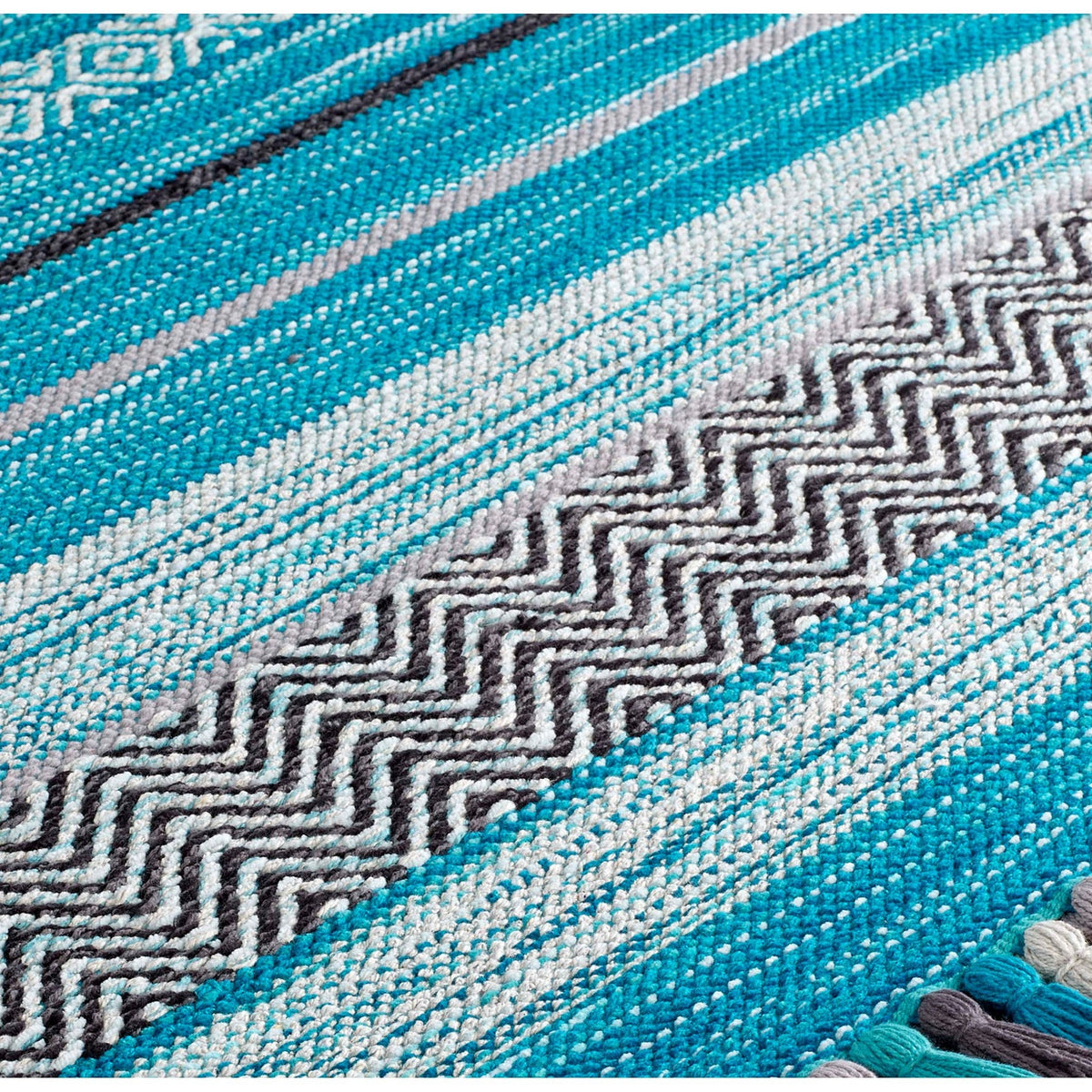 Teal blue kilim rug in natural light