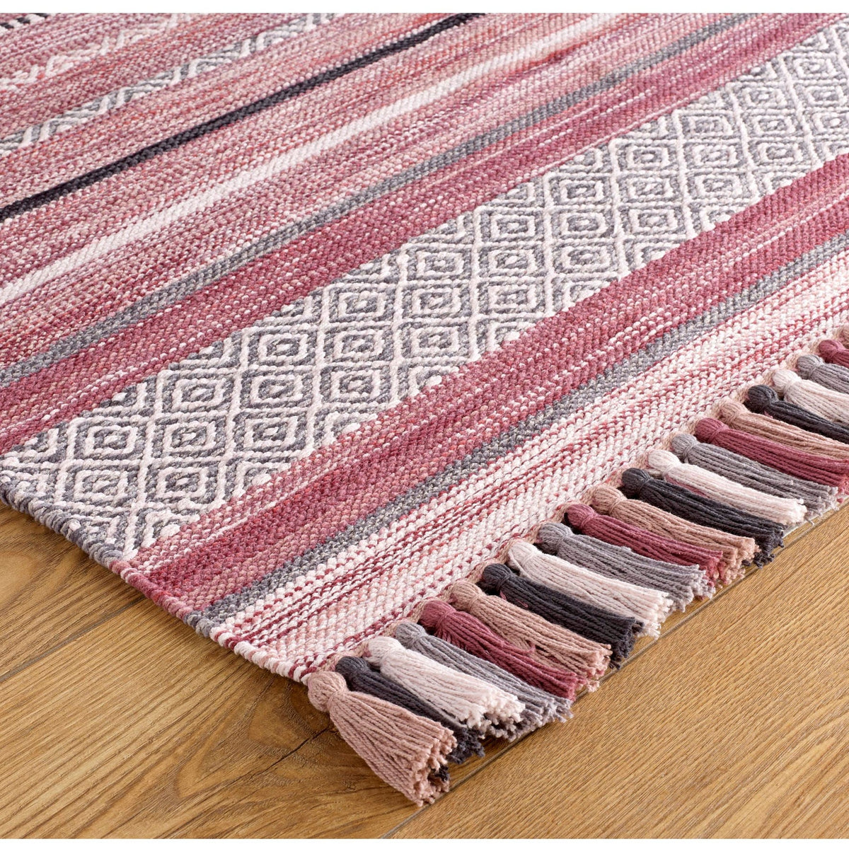 Pink striped dhurrie rug styled in a living room
