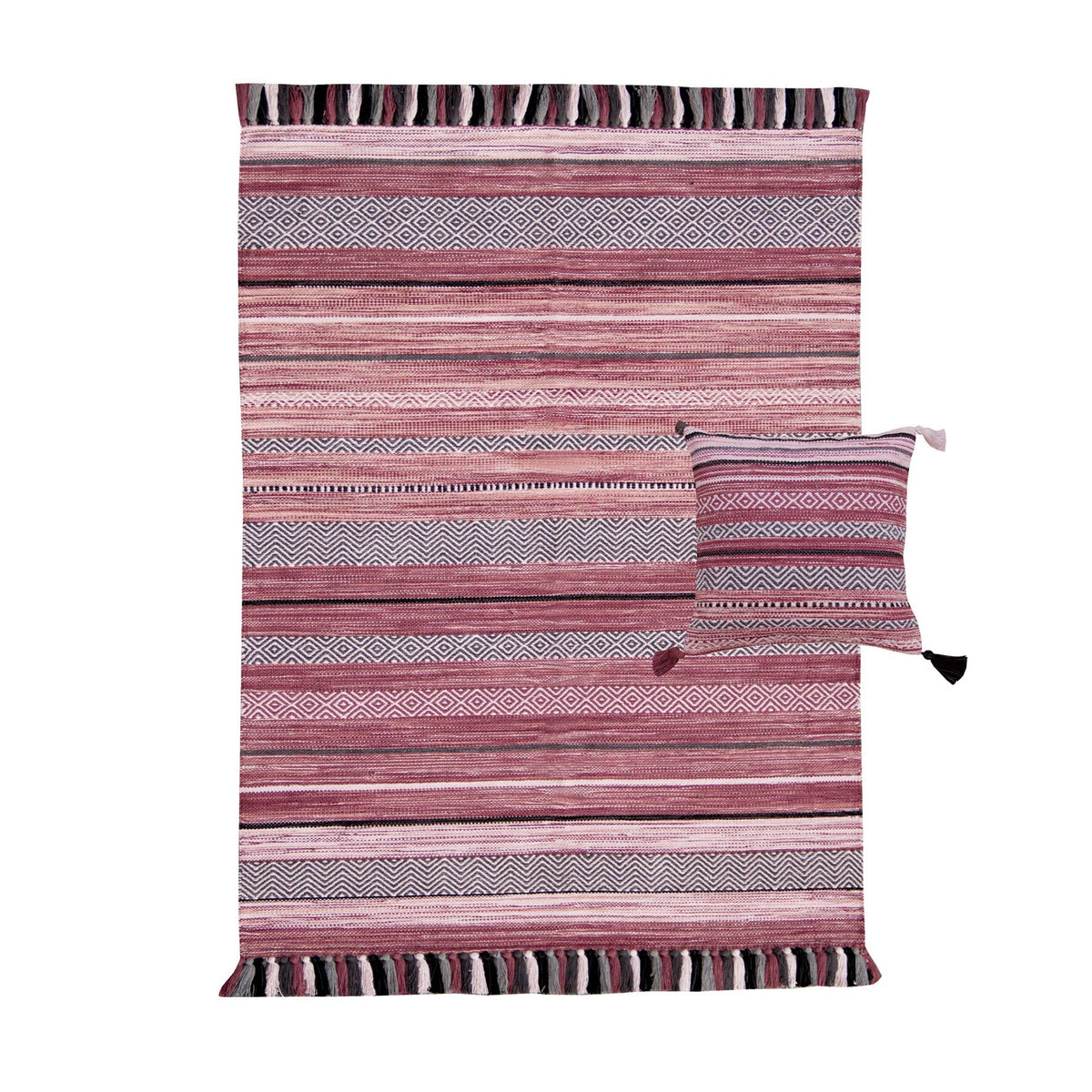 Pink striped dhurrie rug in a bedroom setting