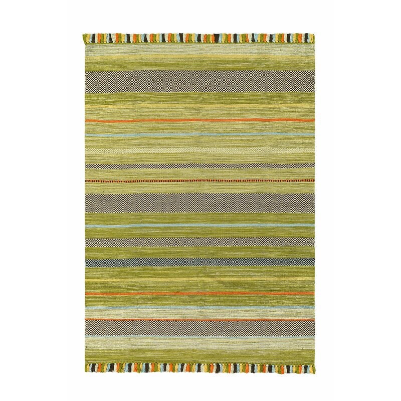 Green kilim rug in natural light