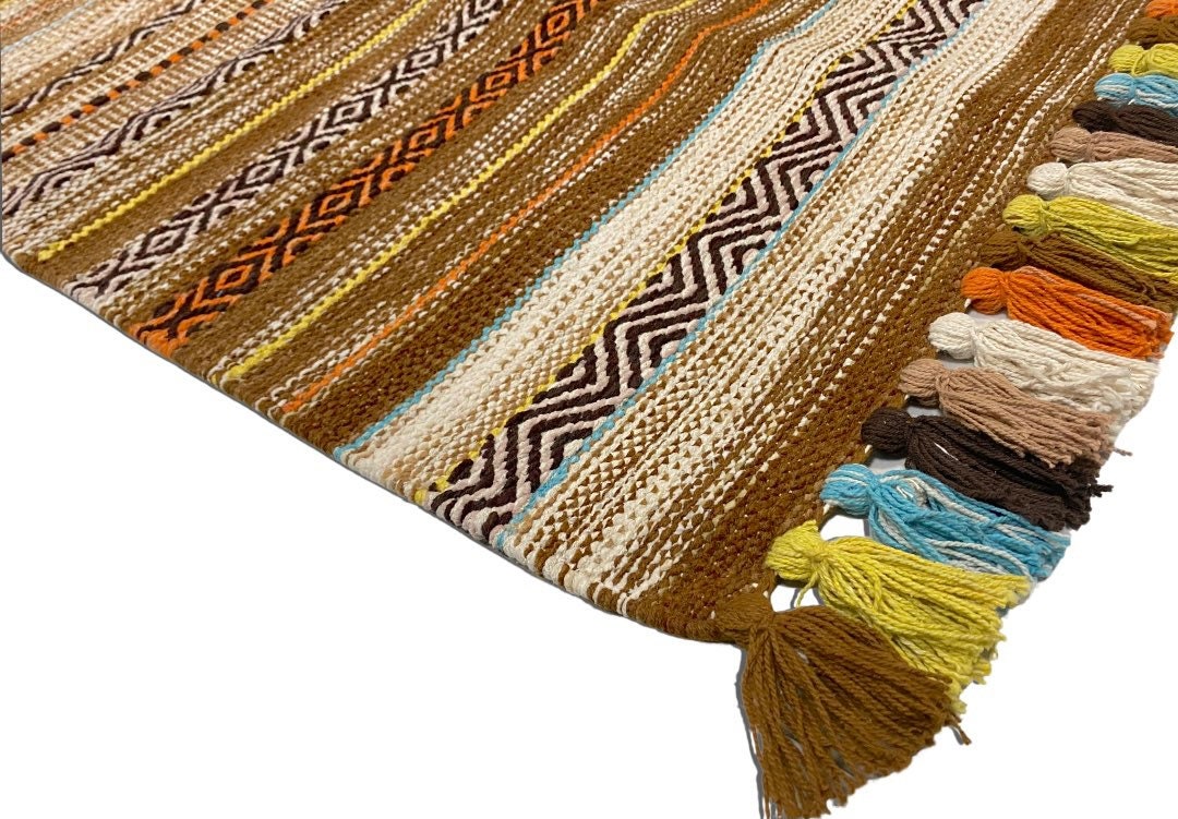 Kilim rug shown in bedroom setting with natural light