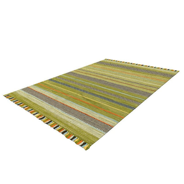 Green kilim rug styled in living room